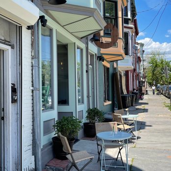 Toasted - a sidewalk with tables and chairs on it - Cocktail Bars Near Me - Newburgh, New York