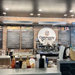 a coffee shop counter and menus a coffee shop counter and menus