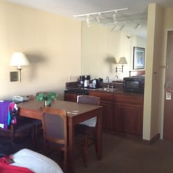 Midlane Suites - Dining area. fridge. Microwave. Coffeemaker. Sink.