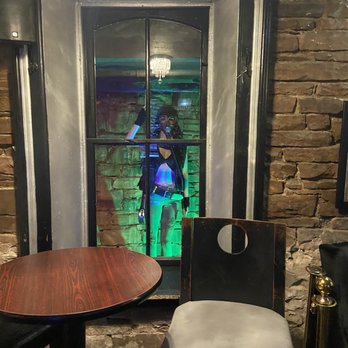 The Speakeasy - a person in a window - Speakeasies Near Me - Longmont, Colorado