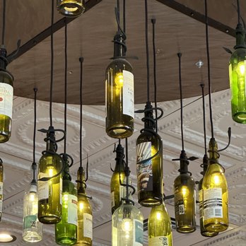 Grimaldi's Pizzeria - a bunch of wine bottles hanging from the ceiling - Desserts Near Me - Plano, Texas Grimaldi's Pizzeria - a bunch of wine bottles hanging from the ceiling - Desserts Near Me - Plano, Texas