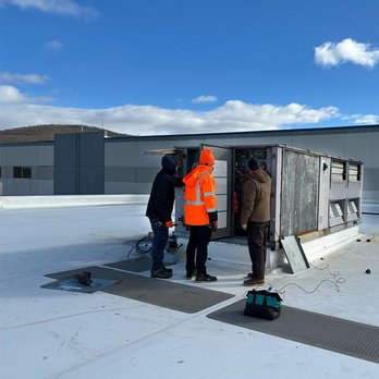 Advanced Comfort Technologies - A large RTU being serviced by the ACT HVAC team on a rooftop. - Heating & Air Conditioning/HVAC Near Me - Marlboro, New York
