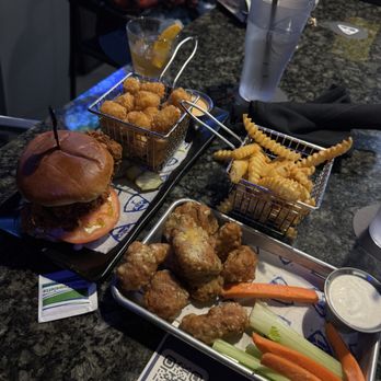 Topgolf - Garlic parm wings & chicken sandwich with tots - Sports Bars Near Me - Ontario, California Topgolf - Garlic parm wings & chicken sandwich with tots - Sports Bars Near Me - Ontario, California