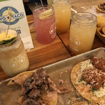 Avo Taco - Going at it- left bitten taco is Juanita and right is Coco Loco - Cocktail Bars Near Me - New Hyde Park, New York Avo Taco - Going at it- left bitten taco is Juanita and right is Coco Loco - Cocktail Bars Near Me - New Hyde Park, New York