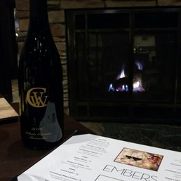 Great table in front of the fireplace. They have a reasonable corkage fee and also a wonderful selection of local wines as well. Great table in front of the fireplace. They have a reasonable corkage fee and also a wonderful selection of local wines as well.