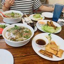 Hot and rich beef broth pho and crunchy rolls :) !