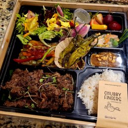 Doshirak with bulgogi, roasted shishito peppers, yuzu salad, jap chae (korean glass noodle dish), shrimp spring roll.