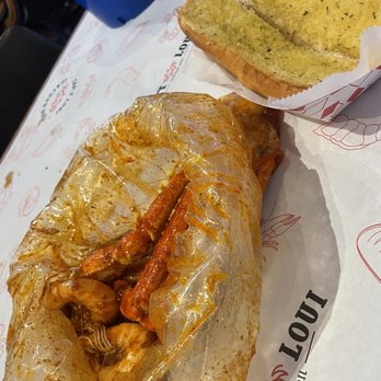 Cap't Loui - 1/2 lb Shrimp Head On and Snow Crab legs with garlic bread - Cajun/Creole Near Me - Duluth, Georgia