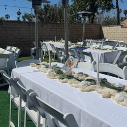 Heaters, tables, linens, & white resin chairs Heaters, tables, linens, & white resin chairs