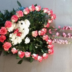 Tania's Flower Arrangements - Don't no y photo sideways, but it was de most glorious arrangement! I like dogs, and de roses were perfect! Fragrance of roses filled room