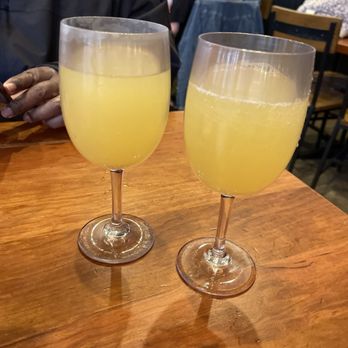 Ruby Slipper Central Business District - Peach pineapple mimosas - Breakfast & Brunch Near Me - New Orleans, Louisiana Ruby Slipper Central Business District - Peach pineapple mimosas - Breakfast & Brunch Near Me - New Orleans, Louisiana