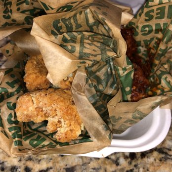 Wingstop - a basket of fried food on a counter - Chicken Wings Near Me - Kent, Washington Wingstop - a basket of fried food on a counter - Chicken Wings Near Me - Kent, Washington