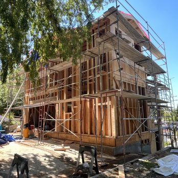 Borja Renovations - Balloon framing an enclosed staircase with landing lounge - General Contractors Near Me