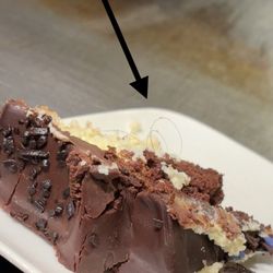 Whole Foods Market - Slice of cake with the hair stuck inside.