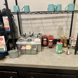 Sicily's Pizza - Biloxi - Condiments, silverware, and hot coffee.