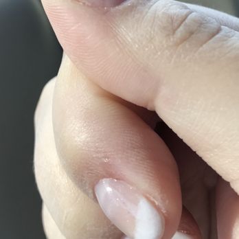JJ Nails - French powder dip disaster: air bubbles, sheer white tip, fuzzy/smudge white tip lines, black debris, lifting causing pressure/discomfort. - Nail Salons Near Me - North Fort Myers, Florida