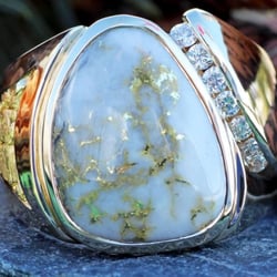 Gold Rush Fine Jewelry - Hand made custom ring with a stunning gold quartz center stone with natural Alaskan gold nuggets and diamonds.