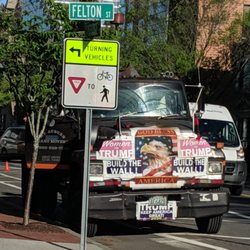 A Plus Mt Auburn Piano Movers - Trump/anti-immigration propaganda covering work vehicle