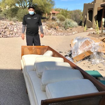 Merit Moving Systems - Delivery driver with cane-back couch, ready for placement. - Movers Near Me - Thousand Palms, California Merit Moving Systems - Delivery driver with cane-back couch, ready for placement. - Movers Near Me - Thousand Palms, California