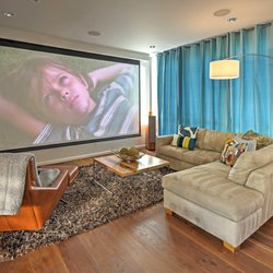 Hifi Install - This 160in (!) Motorized drop-down theater screen is completely hidden by a custom buildout when not in use.