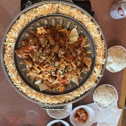 Seoul Soul - Fire chicken and side dishes (sweet and salty potatoes, kimchee, and fish cakes)