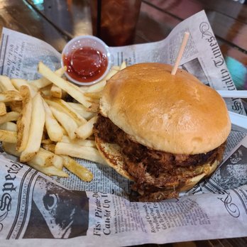 Whiskey Barrel Saloon - Pulled pork sandwich with a side of fries - American Near Me - Rock Falls, Illinois