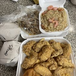 Captain Dat - Wings, shrimp fried rice, turkey neck, hot sausage on bun, shrimp on bun.