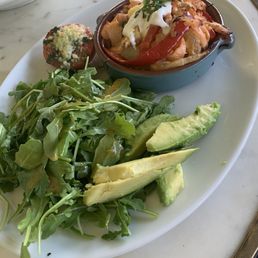 SMOKED AND FRESH SALMON HASH* with roasted potatoes, caramelized onions and peppers, fresh dill and topped with crème fraiche and avocado SMOKED AND FRESH SALMON HASH* with roasted potatoes, caramelized onions and peppers, fresh dill and topped with crème fraiche and avocado