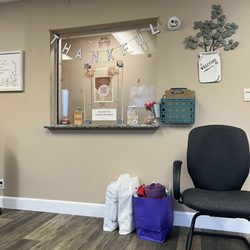 Life Choice Pregnancy Center - Font desk while sitting on the couch. My full bags of diapers and essential items for the baby