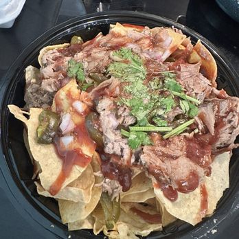 Times Grill - Pulled pork nachos (queso was in a separate bowl) - American Near Me - Mandeville, Louisiana Times Grill - Pulled pork nachos (queso was in a separate bowl) - American Near Me - Mandeville, Louisiana
