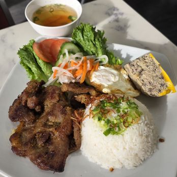 Banh Mi Ong Muoi - Grilled pork chop rice dish with egg meatloaf and fried egg. - Sandwiches Near Me - Chicago, Illinois