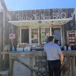 Follow Yer Nose Smoke Wagon - Small stall with outdoor seating.