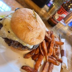 The Durham - Kitchen and Cocktails - The Durham Burger with pepper jack on a GF bun and sweet potato fries. This was the best meal of the three we ordered