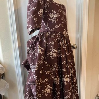 Designs From Time - It has a close-fitting bodice and the back of the skirt gathered up into three puffed sections to reveal the petticoat below. - Costumes Near Me - Bonney Lake, Washington