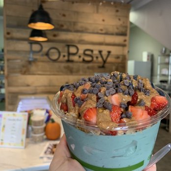 PoPsy - a hand holding a bowl of food - Wraps Near Me - Tupelo, Mississippi PoPsy - a hand holding a bowl of food - Wraps Near Me - Tupelo, Mississippi