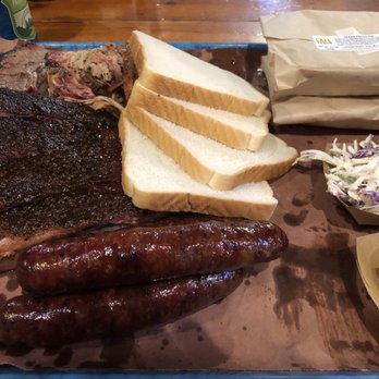 Franklin Barbecue - Some of everything: brisket, ribs, pulled pork, sausage links, and turkey with a side of slaw and potato salad - Barbeque Near Me - Austin, Texas
