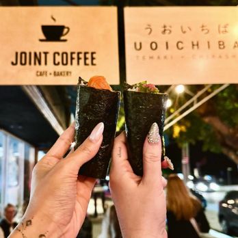 Uoichiba - two people holding up sushi rolls - Sushi Bars Near Me - Los Angeles, California