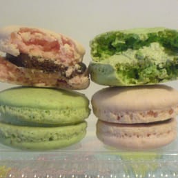 Macarons, $1.59 CAD each.  Flavours: strawberry chocolate, pistachio.
