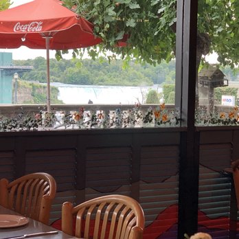 The Secret Garden Restaurant - View of American fall from inside - Breakfast & Brunch Near Me - Niagara Falls, Ontario The Secret Garden Restaurant - View of American fall from inside - Breakfast & Brunch Near Me - Niagara Falls, Ontario