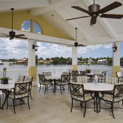 The Yardarm Veranda overlooks picturesque Naples Bay and provides the perfect location for outdoor dining.