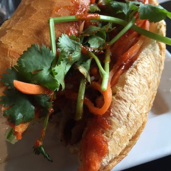Sidestreet Pho - Grilled pork banh mi plus siracha and hoisin sauce. Yummy but like half the size of what it should be for an outrageous $6. - Vietnamese Near Me - Alameda, California
