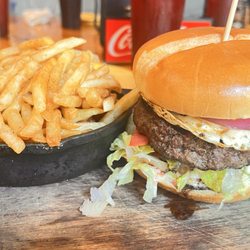G's Pizza - G's Famous Hamburger. 1/2 lb Burger, pepper jelly aioli, fried egg, cheese blend, red onions, lettuce, and tomato.