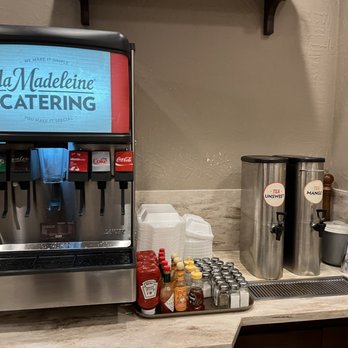 la Madeleine - a coffee machine and a coffee pot on a counter - Bakeries Near Me - Houston, Texas
