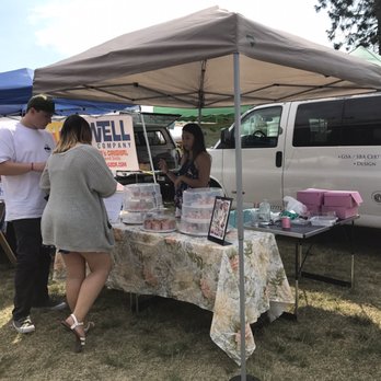 Ooh La Va - a couple of people standing under a tent - Desserts Near Me Ooh La Va - a couple of people standing under a tent - Desserts Near Me