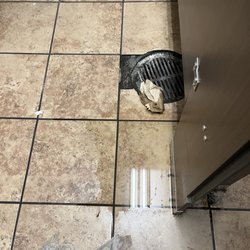 Kroger - Water on floor like the toilet possibly overflowed. Not good.