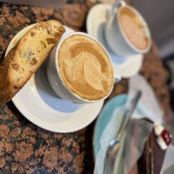 Stella Pastry & Cafe - Pumpkin spice latte with almond biscotti. Chocolate raspberry mousse and a mocha.