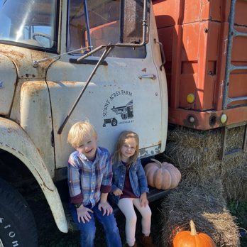 Sunny Acres Farm - two children sitting in front of an old truck - Farmers Market Near Me - Louisville, Kentucky Sunny Acres Farm - two children sitting in front of an old truck - Farmers Market Near Me - Louisville, Kentucky