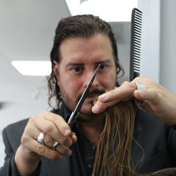 Riser & Co Salon - Riser working to give his client the perfect haircut for her natural curls - Hair Salons Near Me - Cedar Park, Texas Riser & Co Salon - Riser working to give his client the perfect haircut for her natural curls - Hair Salons Near Me - Cedar Park, Texas