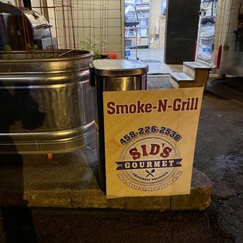 Sid's Gourmet - a sign for smoke n grill - Food Trucks Near Me - Medford, Oregon Sid's Gourmet - a sign for smoke n grill - Food Trucks Near Me - Medford, Oregon