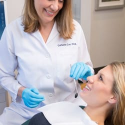 Catherine Cox, DDS - Northgate Dental - Dr. Cox performing a teeth cleaning